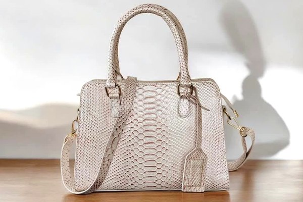 Python-embossed leather handbag